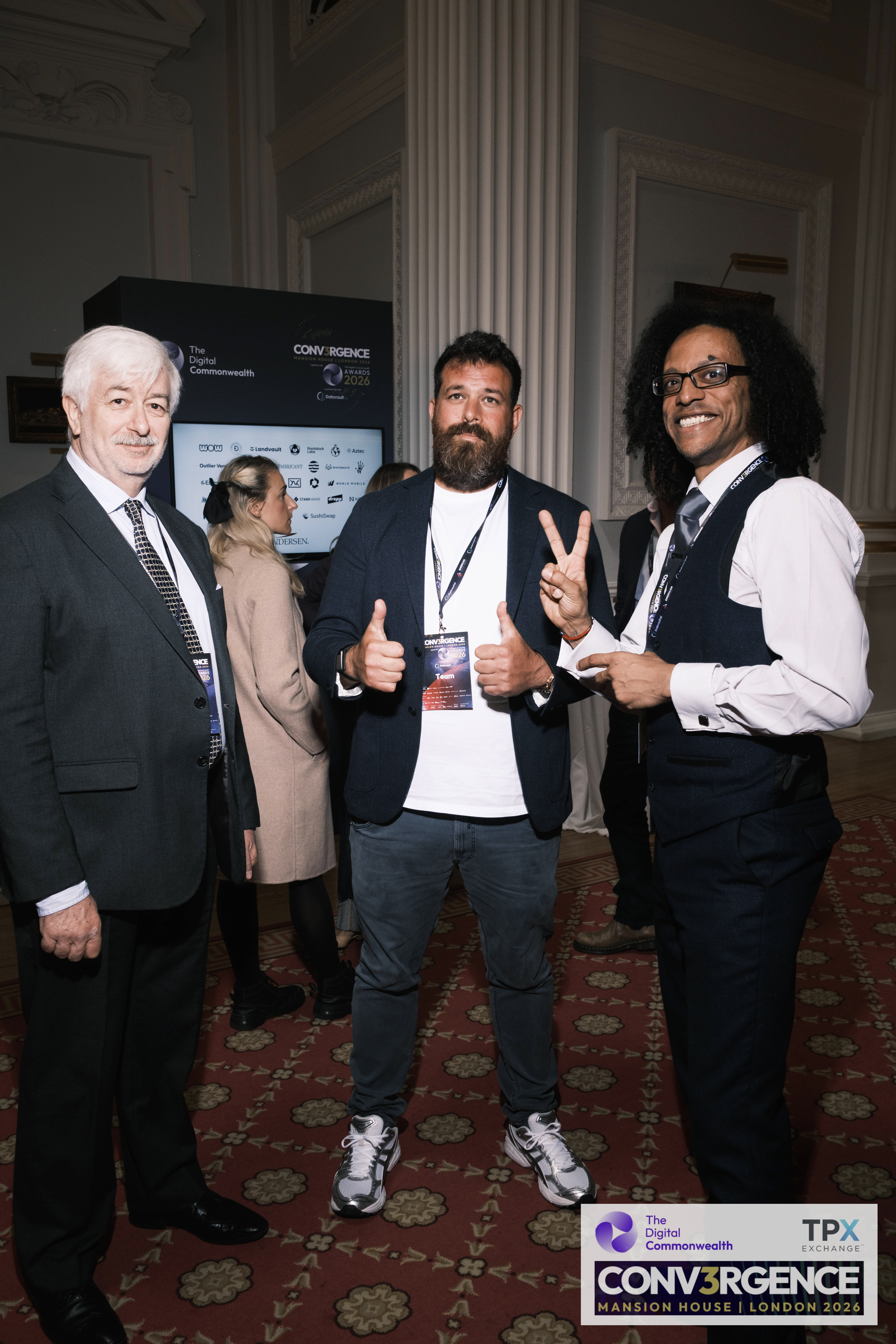 JB Webb-Benjamin posing for a group photo with two colleagues at the Conv3rgence awards reception, Mansion House.